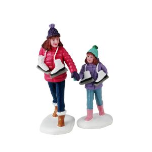 Figurines de patinage entre soeurs